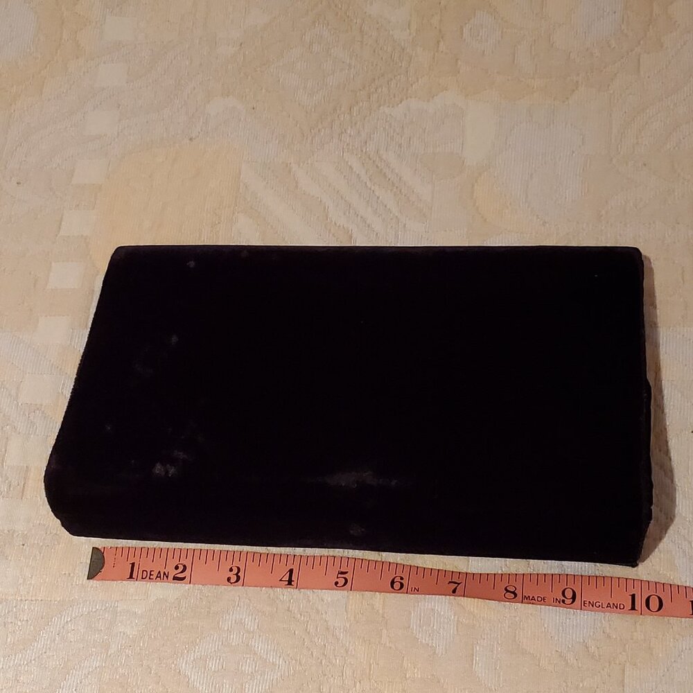 Kenneth Cole black velvet clutch purse with front satin bow detail, long strap